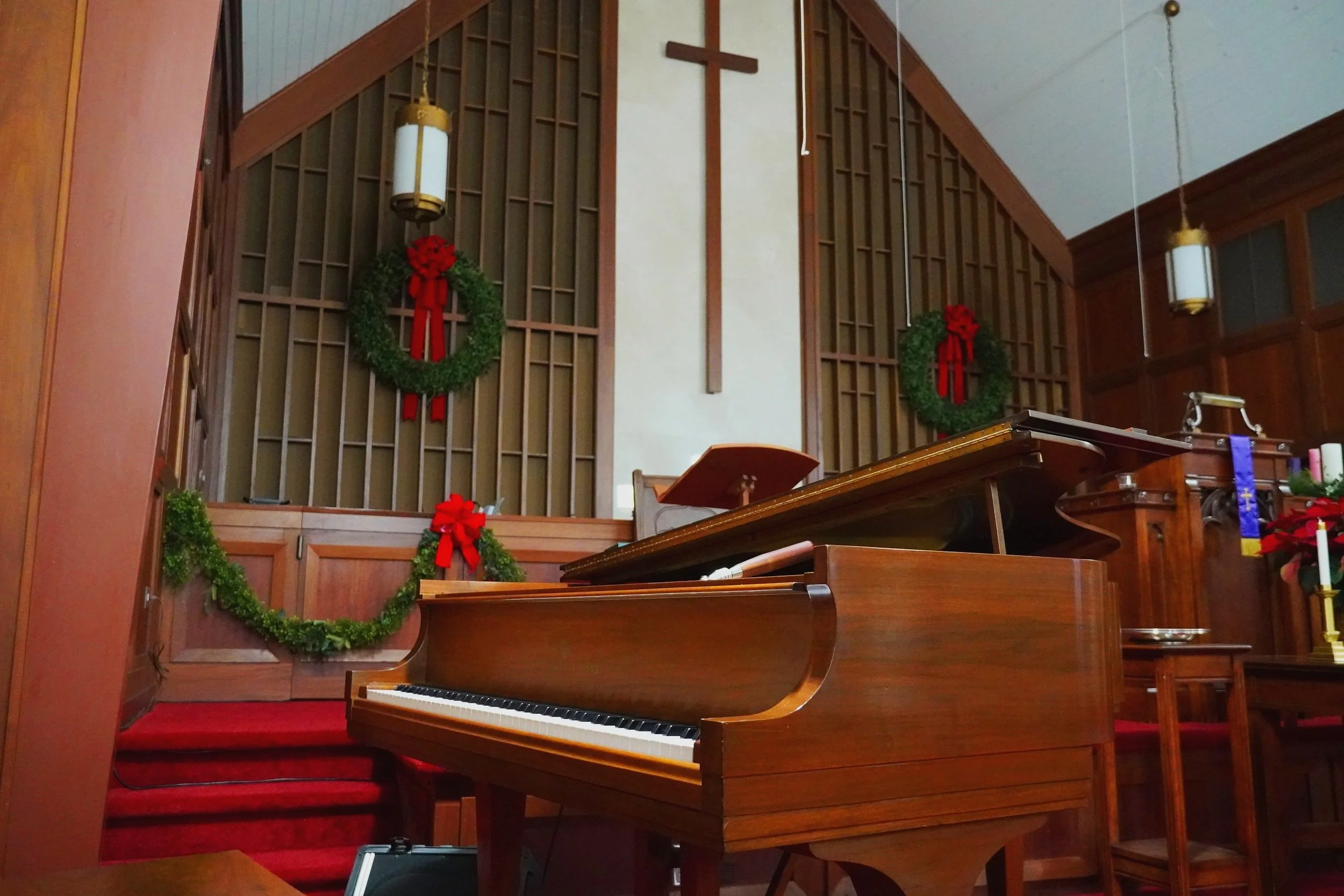 Church decorated for Christmas with piano